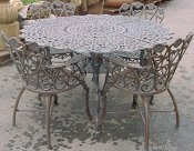Cast aluminum Daisy patio dining set, model A-5015, includes four chairs and one round table