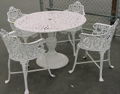 Rose and Lyre cast aluminum patio set with four chairs and pedestal table, model A-5025