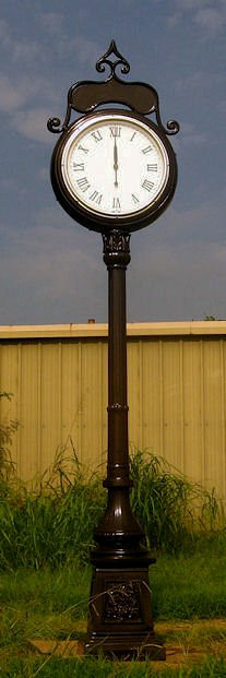 compton clock with roman numerals and a dark bronze finish